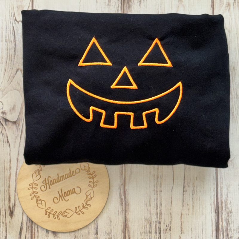 Neon Orange Pumpkin Face Embroidered Apparel